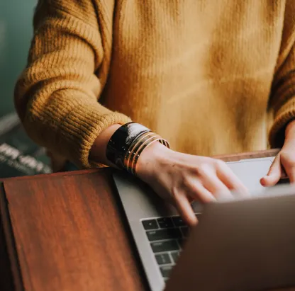 close-up hands on laptop 